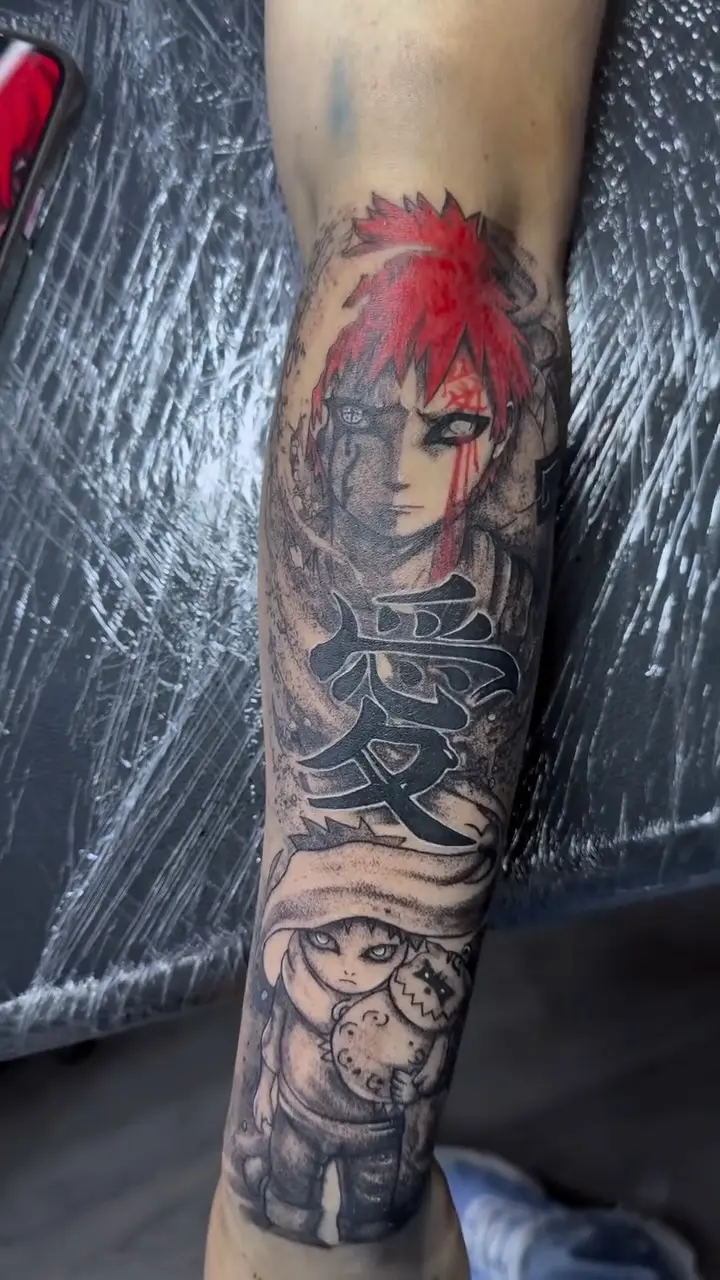 Black and grey calf sleeve of Naruto's Gaara with red-ink hair and Japanese kanji by El Michael at Shadow Studio Charlotte