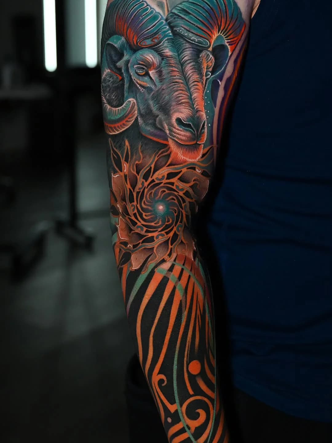 Color cover-up sleeve tattoo featuring a ram portrait by Shadow Studio Charlotte